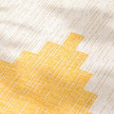 Close-up of the Djugun Yellow Outdoor Rug showing geometric pattern and woven texture. Beige and gold hues. Texture