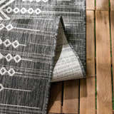 Close-up of the Frankville Black&White All Over Performance Rug showing its geometric pattern and woven texture. Fold