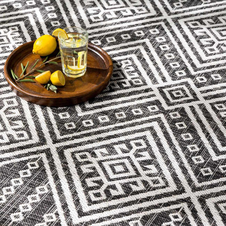 Close-up of the Frankville Black&White All Over Performance Rug, a geometric, bohemian-style rug with a black and white pattern. Styleshot