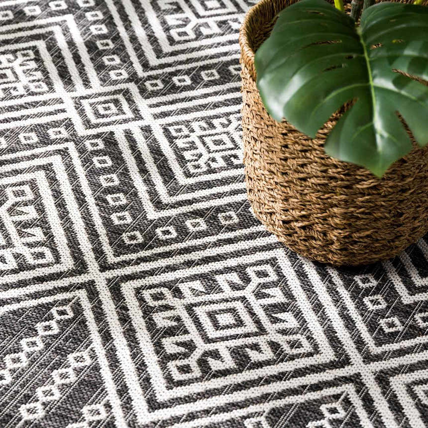 Close-up of the Frankville Black&White All Over Performance Rug with a geometric, Southwestern-inspired pattern. Styleshot