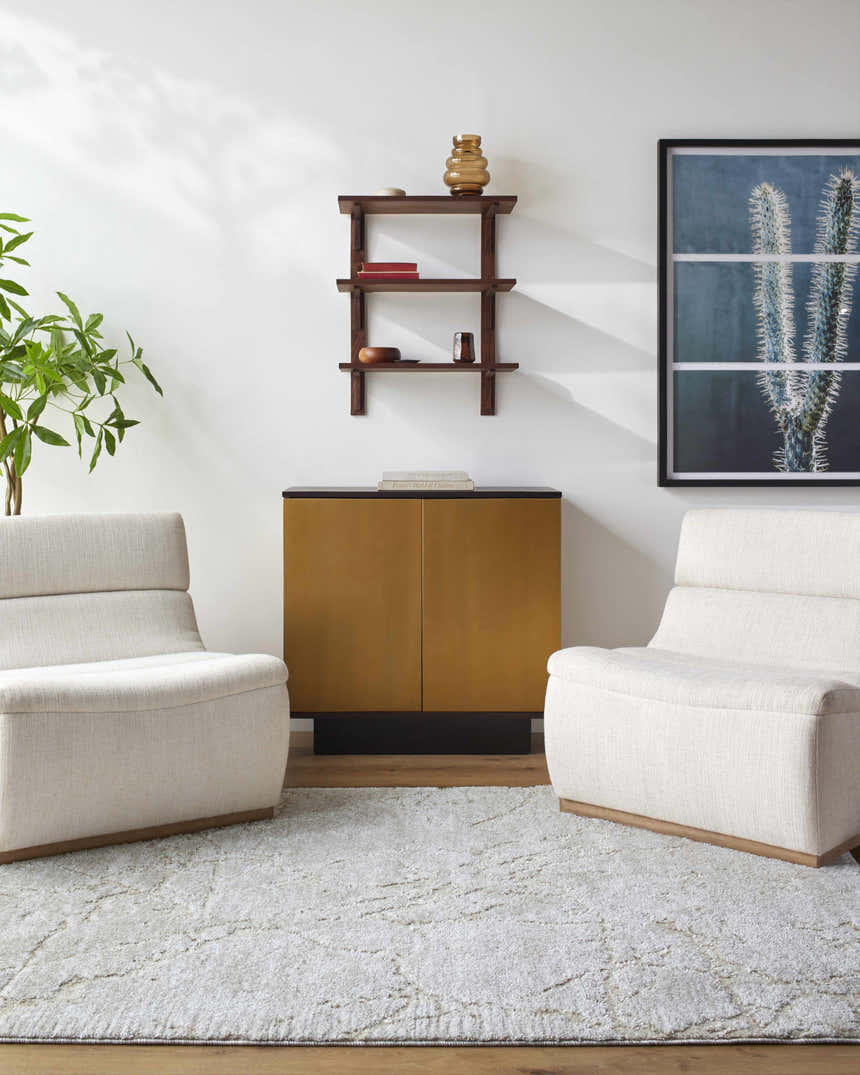Living room scene with two chairs on a light gray Genkei Area Rug in front of a gold cabinet. Roomscene-Rectangle