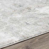 Close-up of the Gilmanton Thick Luxe Boutique Rug showing its gray, beige, and sage abstract pattern and soft texture. Pile