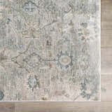 Close up of the Gilmanton Thick Luxe Boutique Rug. Features a traditional floral pattern in dusty sage, gray, and beige tones. Swatch