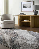 Living room scene with a gray swivel chair and the ivory and gray Ashlee Area Rug. Roomscene-Rectangle