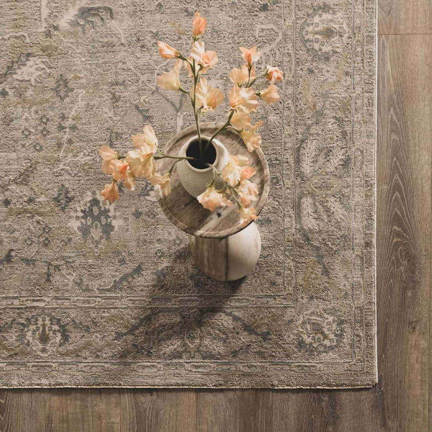 Close-up of a Glengarry Thick Luxe Boutique Rug in dusty sage and beige with a vintage floral pattern. Styleshot