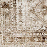 Close-up of Gali Area Rug showing its traditional pattern and colors: cream, dark brown, and faded driftwood. Swatch