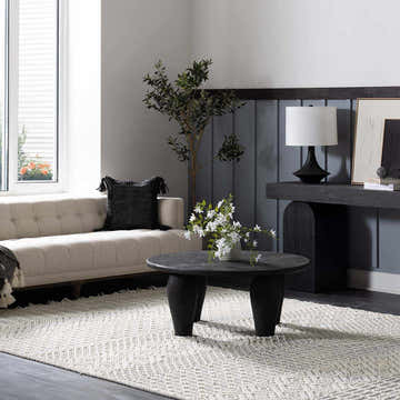 Living room scene with a light sofa and the gray and white geometric Gina Area Rug. Roomscene-Rectangle