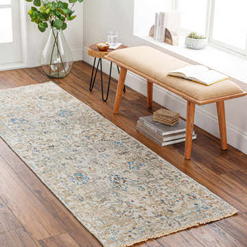 Hallway scene with a brown wood floor and the Gonzaga Premium Rug runner in cream, brown, and blue. Bench and decor complete the space. Roomscene-Runner