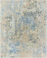 Close-up of the Greenhills Handmade Wool Area Rug, featuring beige, charcoal, and blue abstract patterns. Design-Rectangle-810