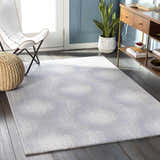 Living room scene with Simpatico Candice Olson x LIVABLISS rug in cream and gray. Modern style with butterfly chair and wood console. Roomscene-Rectangle