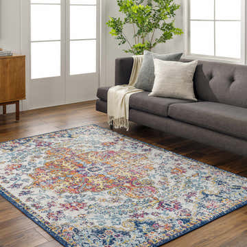 Living room scene with Livabliss Harput HAP-1000 area rug in aqua, blue, and orange. Farmhouse style with gray sofa. Roomscene-Rectangle