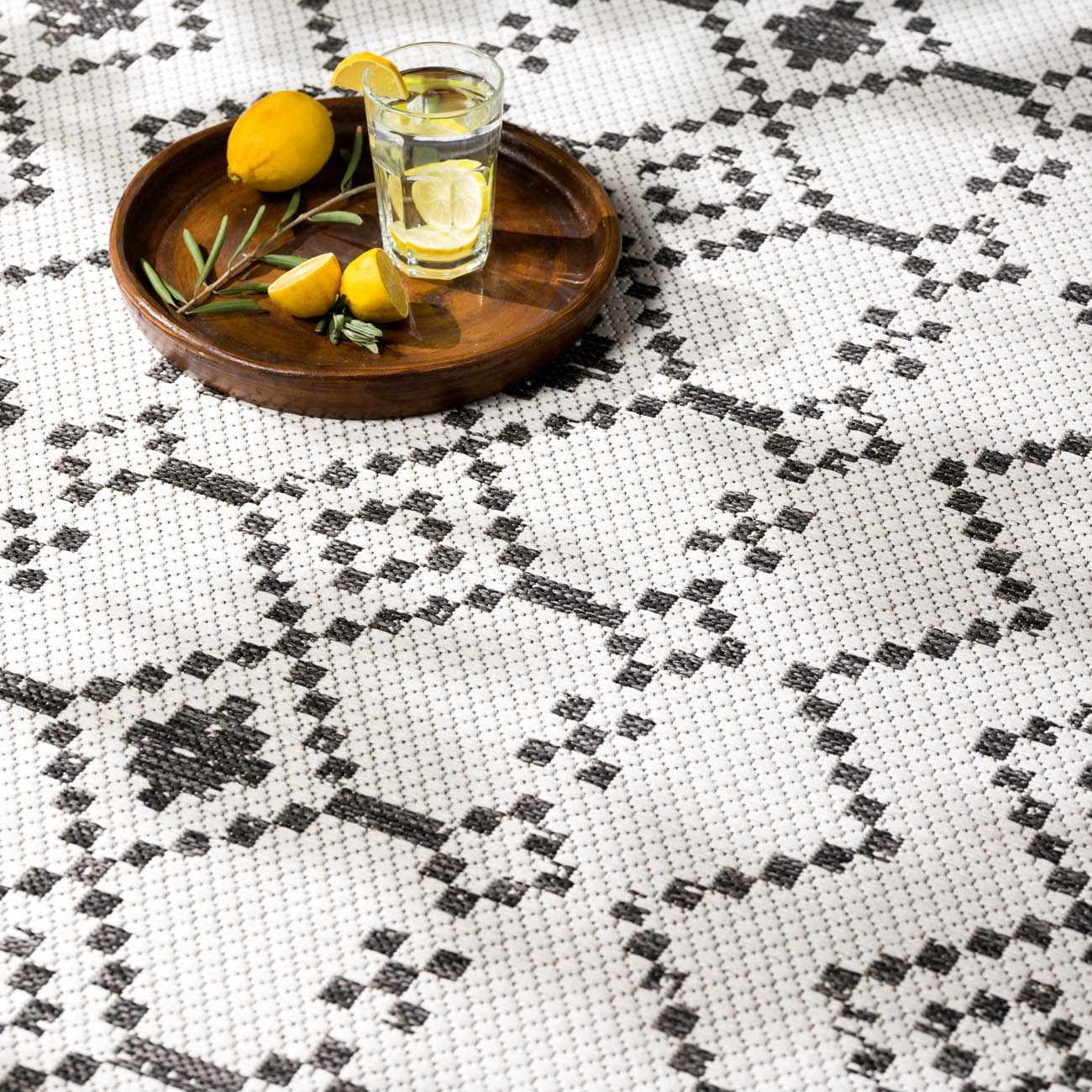 Close-up of the Haynesville Moroccan Design Pixel Rug. Black and white geometric pattern. Bohemian style. Styleshot