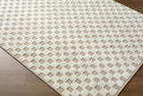 Close-up of the Anthea Light Gray Washable Area Rug. Features a woven, textured geometric pattern in light gray and white. Corner