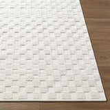 Close-up of the Anthea Off-White 3D Checkered Washable Rug showing its textured, geometric pattern and soft pile. Front