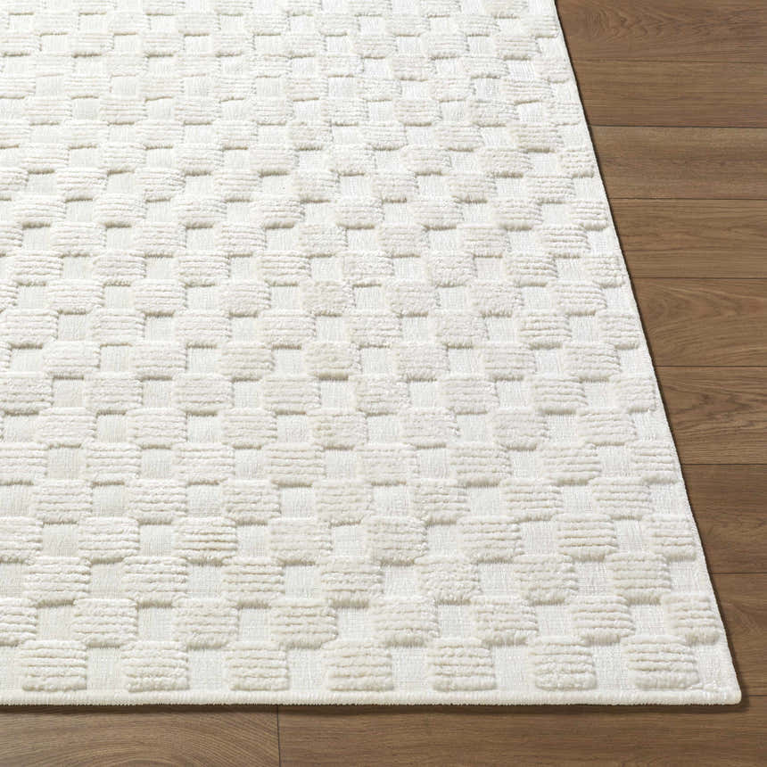Close-up of the Anthea Off-White 3D Checkered Washable Rug showing its textured, geometric pattern and soft pile. Front