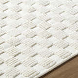 Close-up of the Anthea Off-White 3D Checkered Washable Rug showing its textured, geometric pattern. Texture