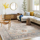 Living room scene with a beige sofa and the Hillcrest Area Rug in beige, blue, and orange tones. Roomscene-Rectangle