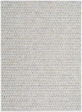 Close-up of the Ataret Ivory Area Rug showing its woven texture and subtle charcoal, blue, and tan colors. Design-Rectangle-537
