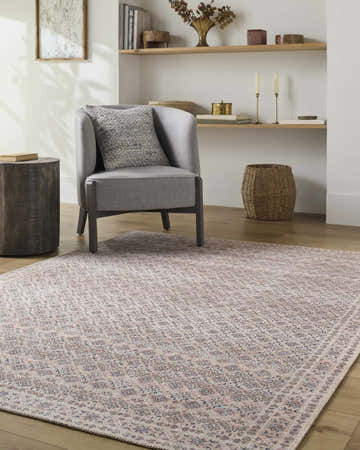 Living room scene with a gray chair on a beige, black, and peach Azalee Washable Runner Rug. Roomscene-Rectangle