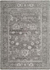 Close-up of the Haruna Area Rug, a machine-woven, rectangular rug with a traditional gray floral pattern and farmhouse style. Design-Rectangle-679