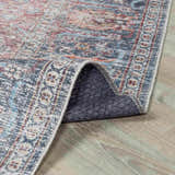 Close-up of Blue Burgundy Holi-2302 washable rug showing its traditional Persian design, colors, and non-slip backing. Fold