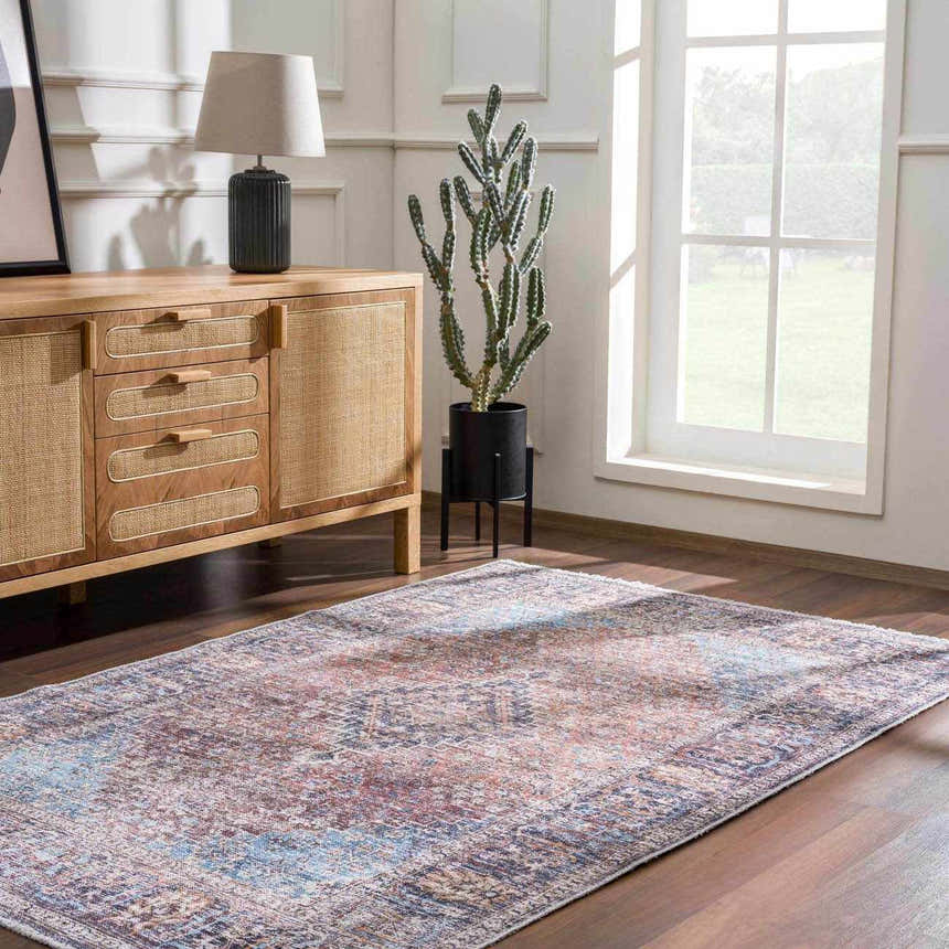 Living room scene with a Blue Burgundy Holi-2302 washable rug, wood cabinet, lamp, and cactus near a window. Roomscene-Rectangle