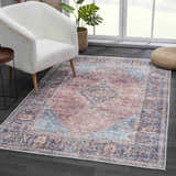 Living room scene with a white chair and the Blue Burgundy Holi-2302 Washable Area Rug. Vintage style. Roomscene-Rectangle