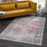 Living room scene with a Blue Burgundy Holi-2302 Washable Area Rug, yellow sofa, dark wood floors, and natural light. Roomscene-Rectangle