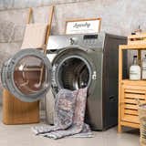 Laundry room scene with Blue Burgundy Holi-2302 Washable Area Rug partially inside a front load washing machine. Washing-Machine