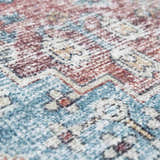 Close-up of the Blue Burgundy Holi-2302 Washable Area Rug, featuring a traditional Persian-style pattern and soft texture. Texture