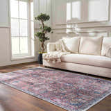 Living room scene with a Burgundy Holi-2303 Washable Area Rug, cream sofa, wood floors, and bright natural light. Roomscene-Rectangle