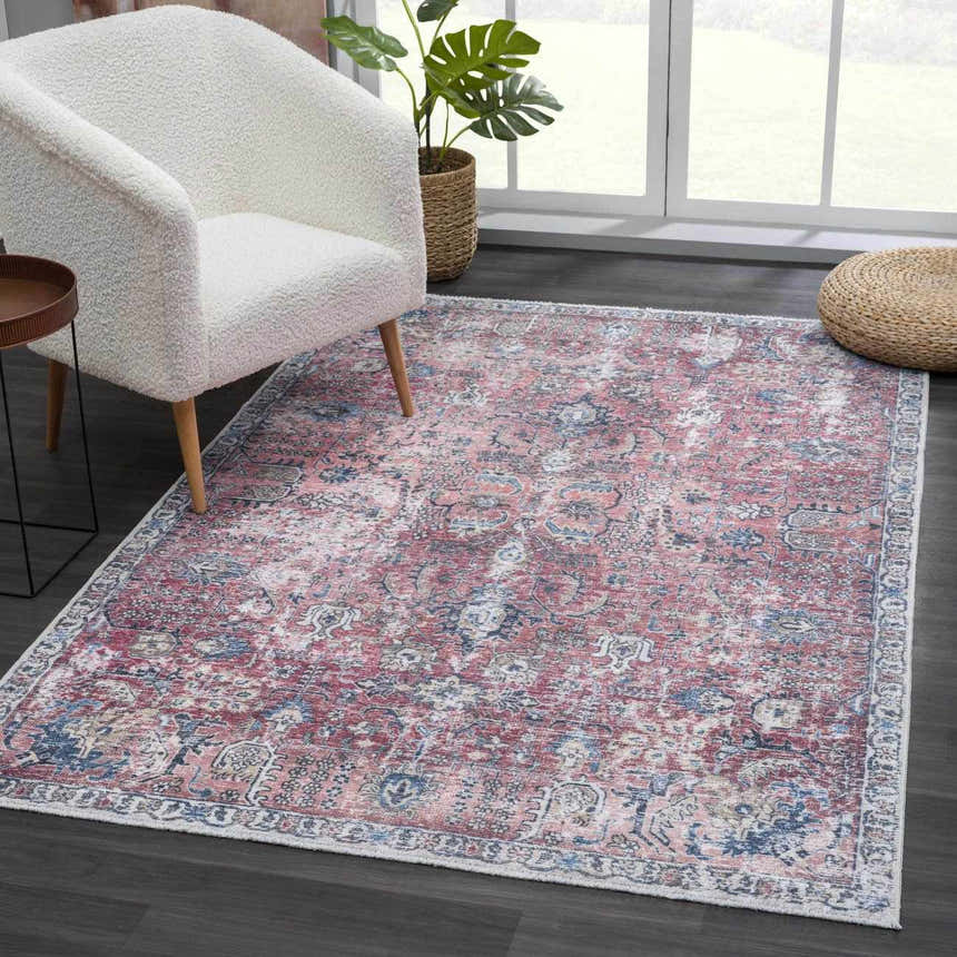 Living room scene with a Burgundy Holi-2303 Washable Area Rug, cream chair, and dark wood floors. Vintage style. Roomscene-Rectangle