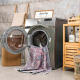 Burgundy Holi-2303 Washable Area Rug in a laundry room, partially inside a washing machine. Farmhouse style decor. Washing-Machine