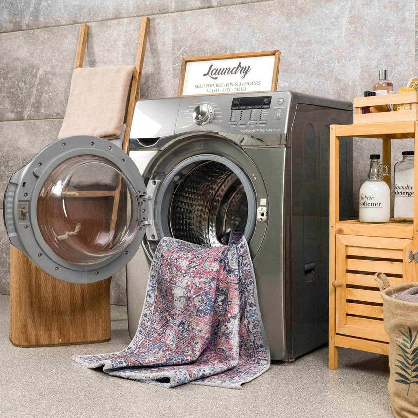 Burgundy Holi-2303 Washable Area Rug in a laundry room, partially inside a washing machine. Farmhouse style decor. Washing-Machine