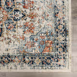 Close up of the Dorval Traditional Rug. Features brick red, cream, denim, and navy hues in an oriental pattern. Swatch