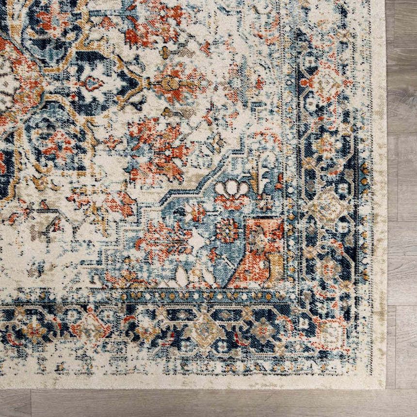 Close up of the Dorval Traditional Rug. Features brick red, cream, denim, and navy hues in an oriental pattern. Swatch