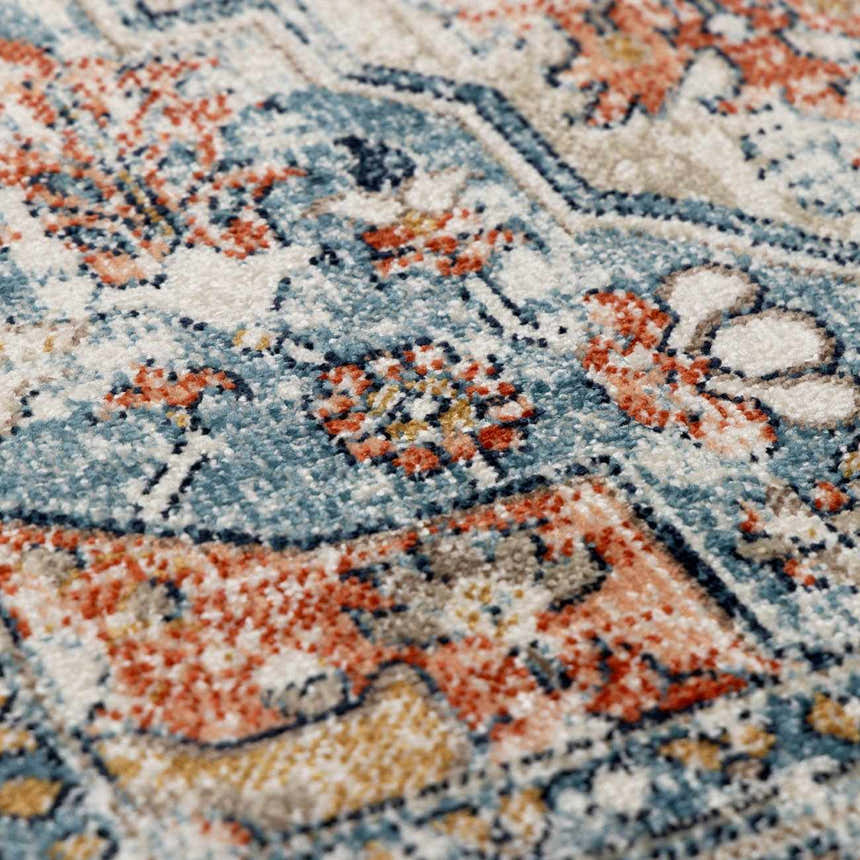 Close-up of the Dorval Traditional Rug, showcasing its brick red, cream, and denim oriental pattern and soft texture. Texture