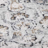 Close-up of the Parkerfield Area Rug showing its beige, black, and gray traditional vintage pattern and machine-woven texture. Texture