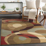 Living room scene with a mid-century chair on a geometric Jackhorn Area Rug in brown, red, green, and blue. Roomscene-Rectangle