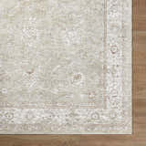 Close up of the Ashraf Area Rug showing its beige, cream, and brown traditional pattern and texture. Corner