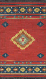 Close-up of the Hedon Wool Area Rug featuring a brick red base and Southwestern-inspired diamond and geometric patterns. Design-Rectangle