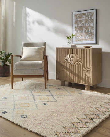 Farmhouse-style room with the Annica Area Rug, a beige wool rug with blush, charcoal, and mustard accents. Roomscene-Rectangle