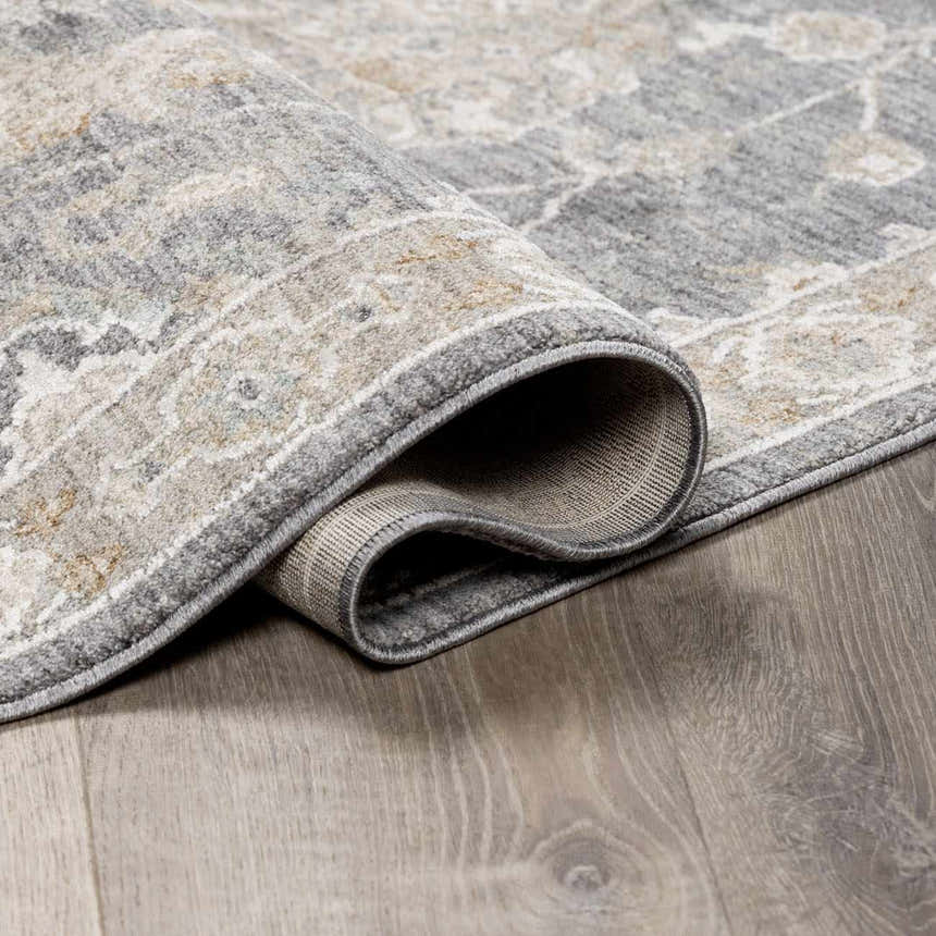Close up of the Kanimbla Thick Luxe Avant Garde Rug showing the gray, beige, and white traditional pattern and texture. Fold