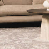 Living room scene with beige sofa and round wood table on Kanimbla Thick Luxe Avant Garde Rug in beige and white. Roomscene-Rectangle