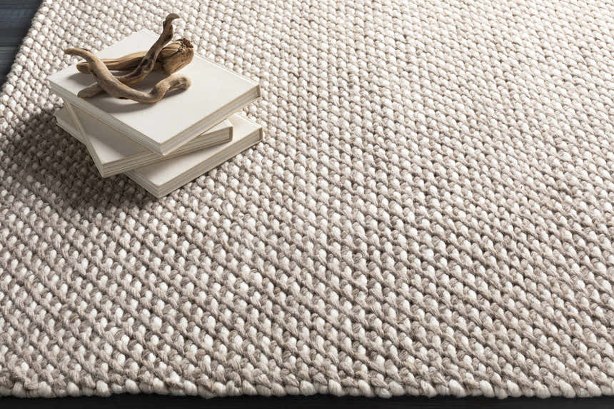 Close-up of the hand woven Keldron Clearance Rug. Charcoal and cream wool and viscose blend with textured, contemporary design. Styleshot