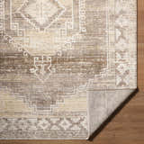 Close-up of the Kailey Light Gray Area Rug, showcasing its traditional pattern, neutral colors, and textured weave. Fold