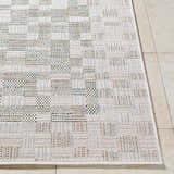 Close up of the Arshad Ivory Area Rug showing beige, tan, and light gray woven pattern. Front