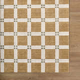 Close up of the Kalkin Light Brown Area Rug, a contemporary caramel and ivory grid pattern with sage accents. Corner