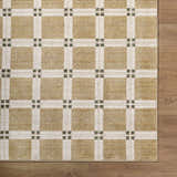 Close-up of Kalkin Tan Area Rug. Contemporary style, tan and cream plaid pattern with olive green accents. Corner