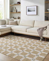 Living room with a cream sectional and Kalkin Tan Area Rug featuring a tan and white geometric pattern. Roomscene-Rectangle